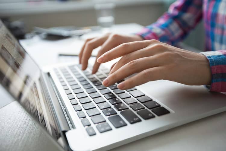 Person reading articles on computer