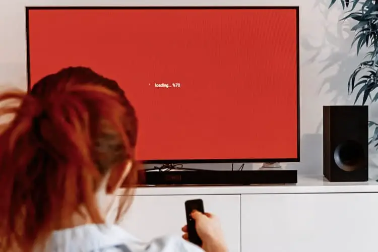 Person using a TV with a soundbar